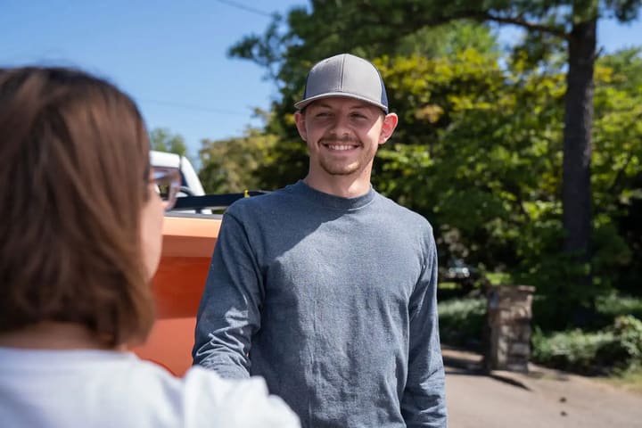 Specialist shaking hands with a homeowner after a free in-home inspection