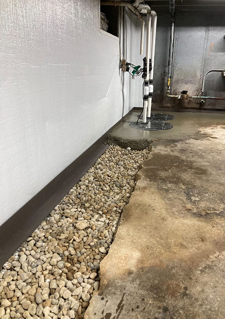 Basement drain tile along the floor perimeter
