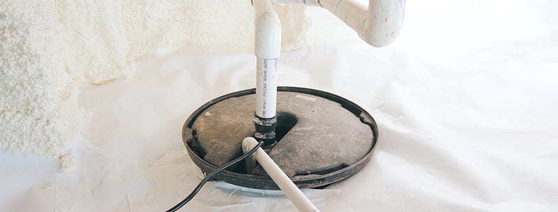 Sump pump basin sealed into a crawl space vapor barrier