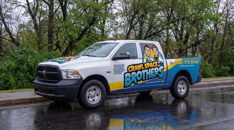 Crawl Space Brothers Truck arriving at a home