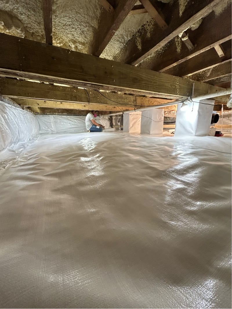 Encapsulated crawl space with a fitted vapor barrier